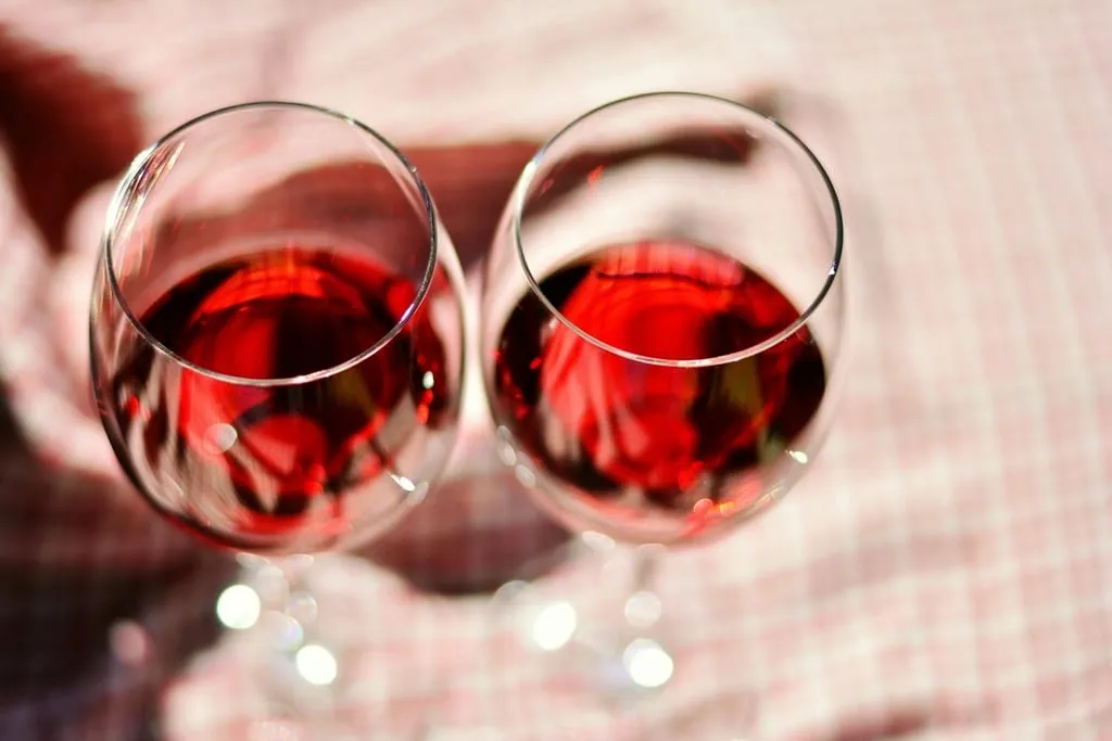 Two glasses of red wine on a table