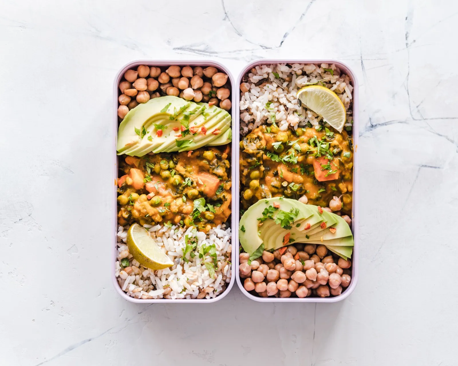 Meal prep containers with chicken, rice and vegetables