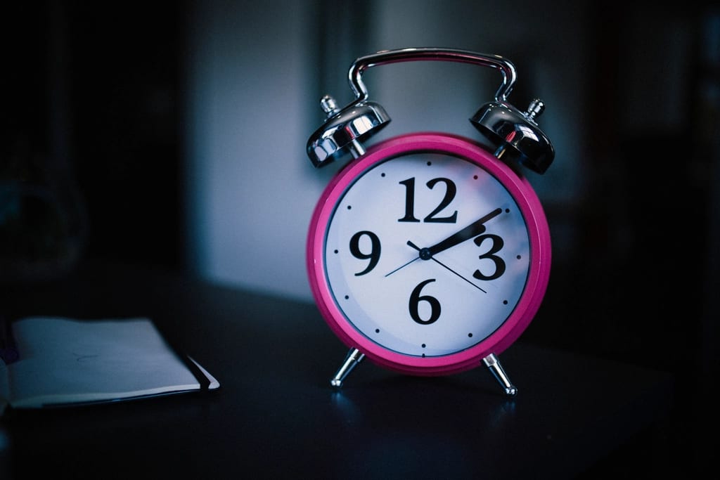 An alarm clock in a dark room