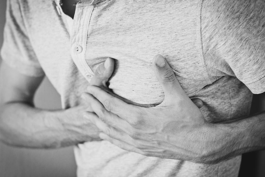 A person holding their chest