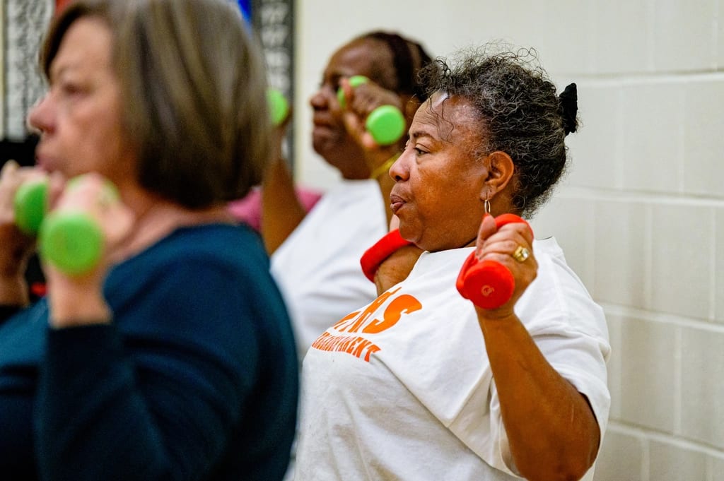 Older women working out with dumbbells