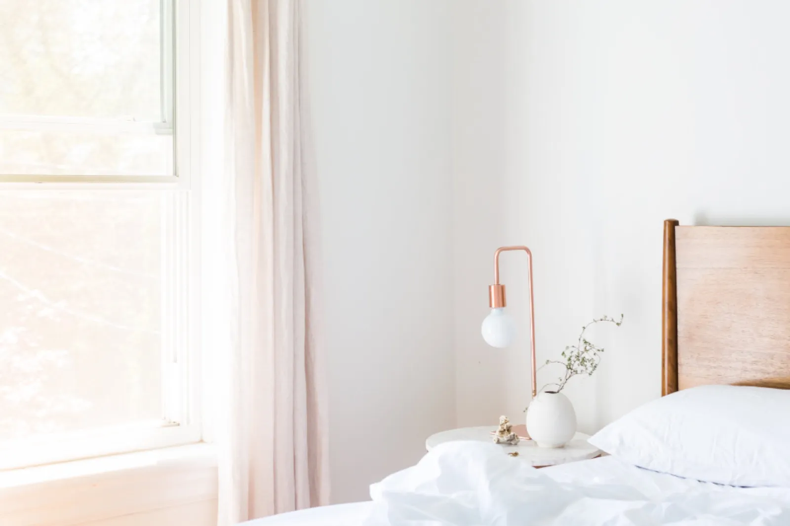 A made bed in morning light
