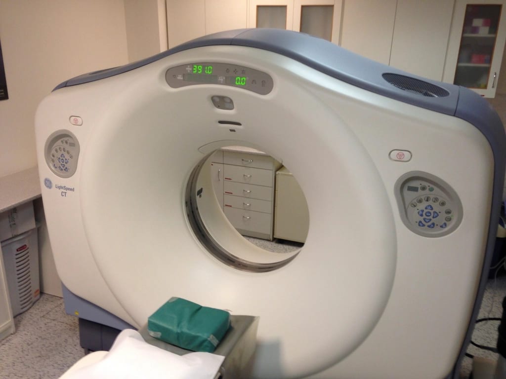 A CT scanner in a hospital room